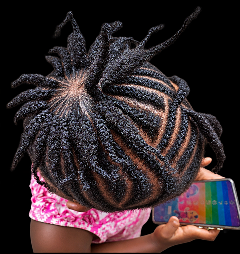 Top view showing clean sections in a child’s natural hairstyle